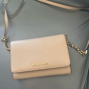 Michael Kors small purse with gold accents…like new!